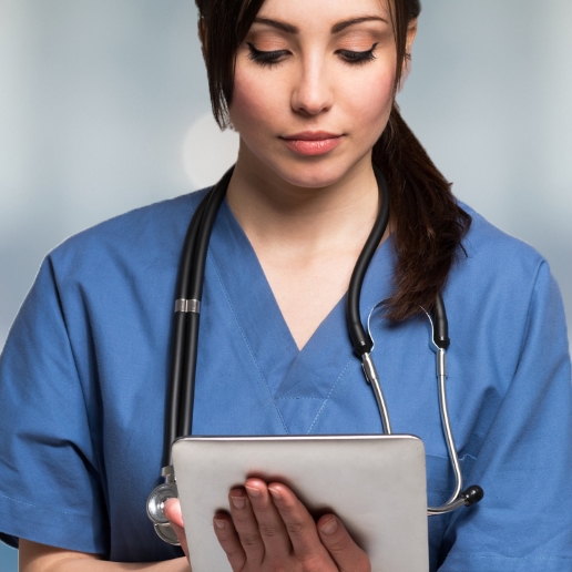 Portrait of a nurse using a digital tablet.